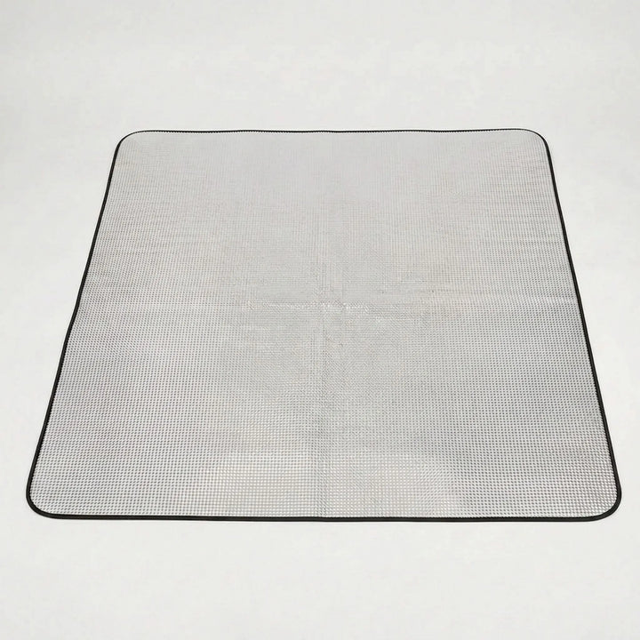 Durable outdoor foldable mat with reflective layer, great for camping, hiking, and recreational ground cover.