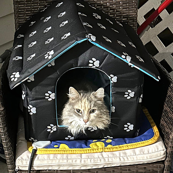 Durable outdoor cat house with integrated self-warming pad, ideal for winter