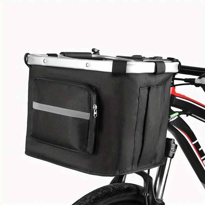 Small pet bike basket, foldable and soft-sided, for easy dog or cat travel on bicycles.