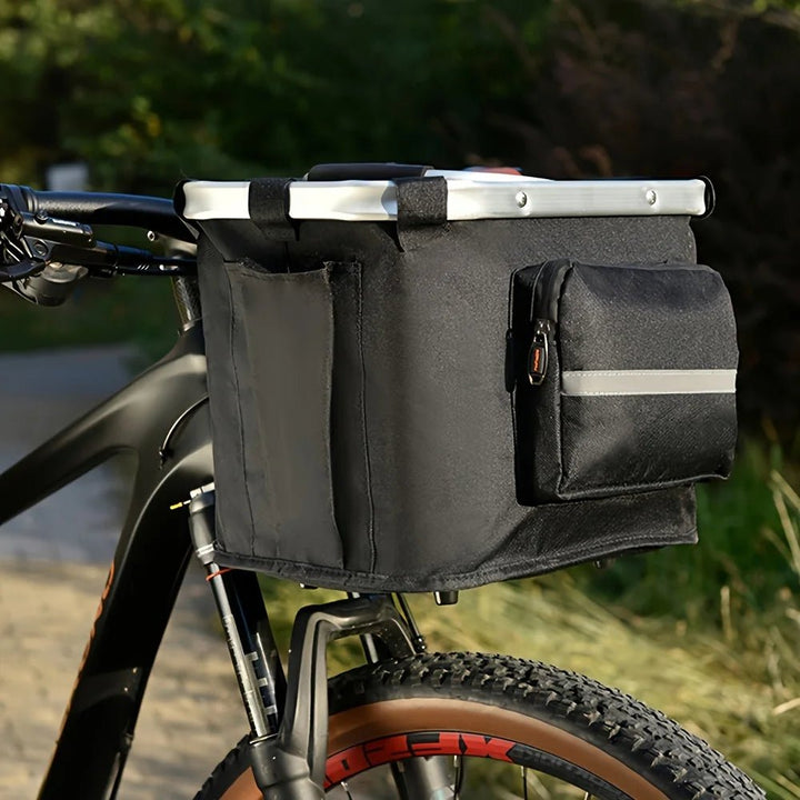 Foldable pet travel basket for bikes, soft-sided carrier for small dogs, cats, and small pets.