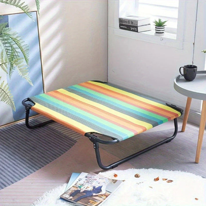 Folded elevated pet bed, portable for travel with dogs & cats, durable and waterproof for outdoor use.
