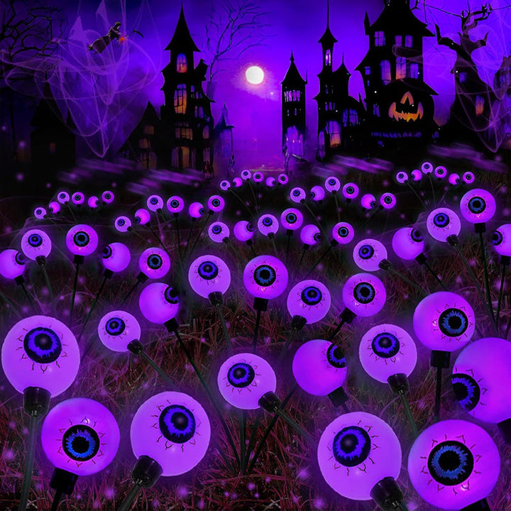 Side view of a solar-powered scary eyeball light, fully charged and ready to glow