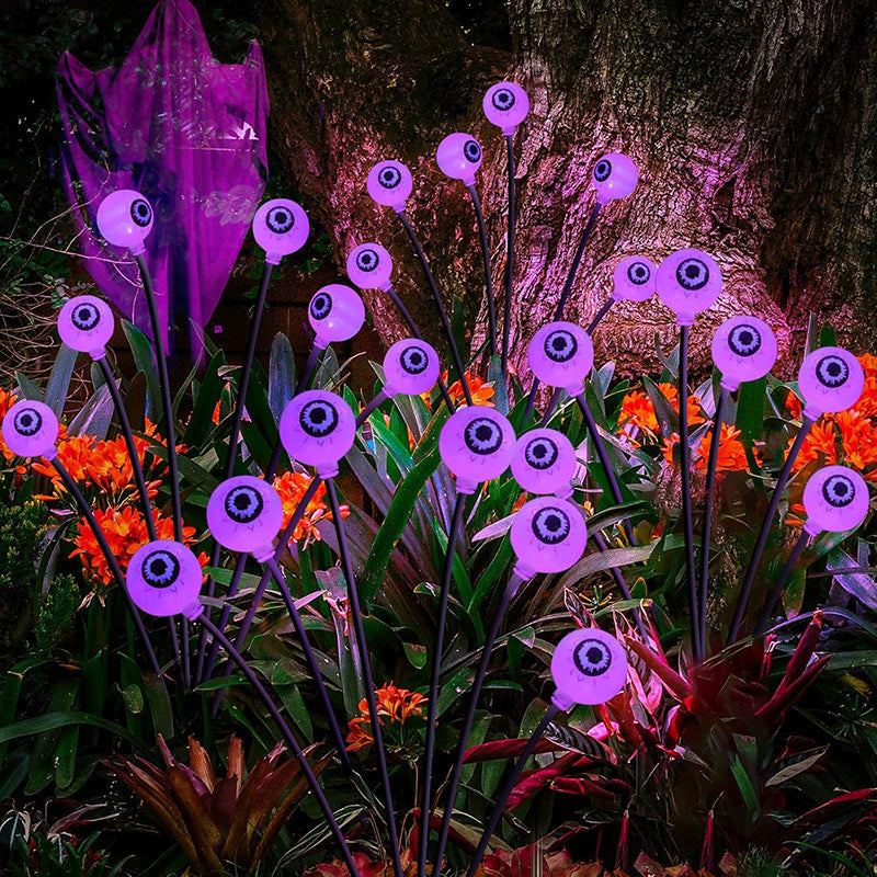 Variety of spooky eyeball designs on solar-powered lights, perfect for outdoor display