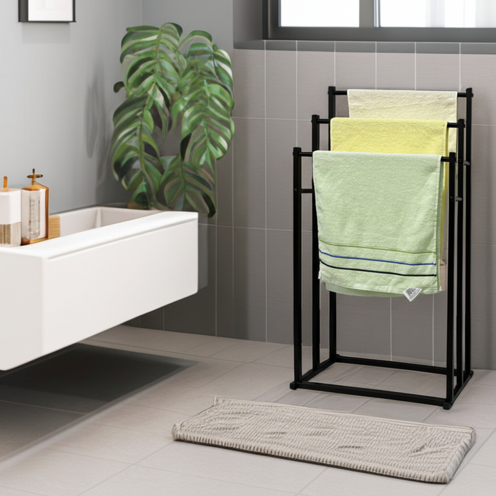 Freestanding steel towel rack for bathroom organization. Modern, compact design for towels.