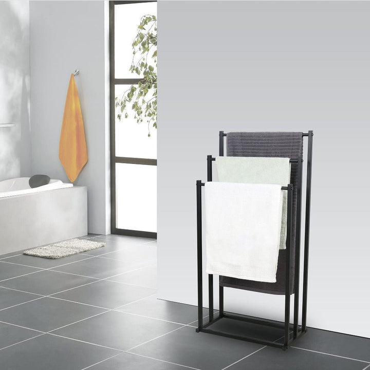 Compact freestanding steel towel rack, perfect for small bathrooms. Stylish storage solution for hand & bath towels.