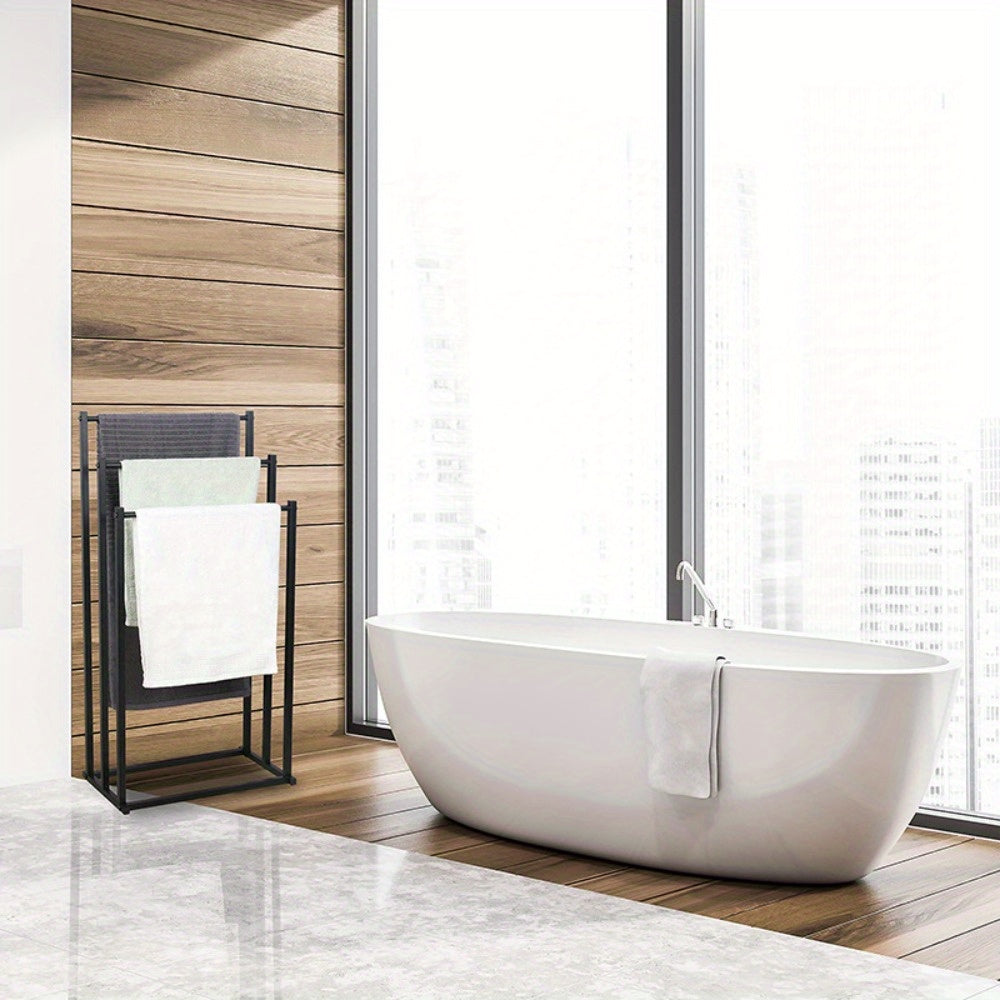 Elegant freestanding steel towel rack enhances bathroom decor. Provides convenient towel storage and organization.