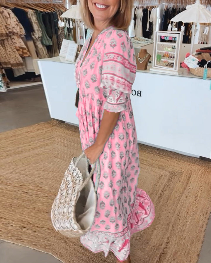 Casual women's V-neck bohemian midi dress with long lantern sleeves, suitable for vacation wear.