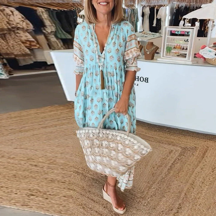 Full view of a women's elegant bohemian midi dress with lantern sleeves, styled for a chic casual look.
