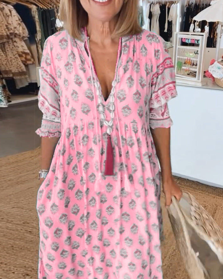 Model wearing a flowy bohemian midi dress with lantern sleeves, walking outdoors for a relaxed look.