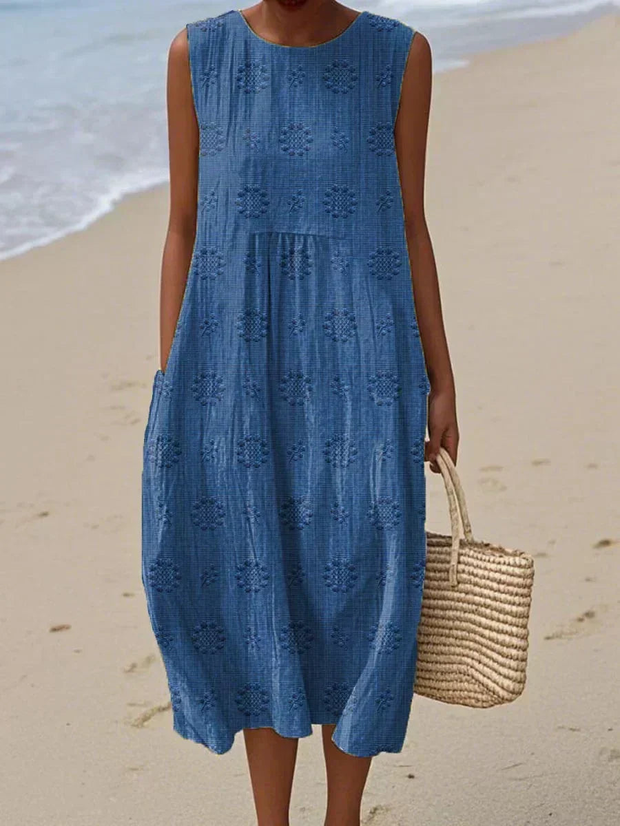 Close-up of a women's casual midi dress pocket, showcasing the convenient storage & soft, flowy fabric perfect for summer.