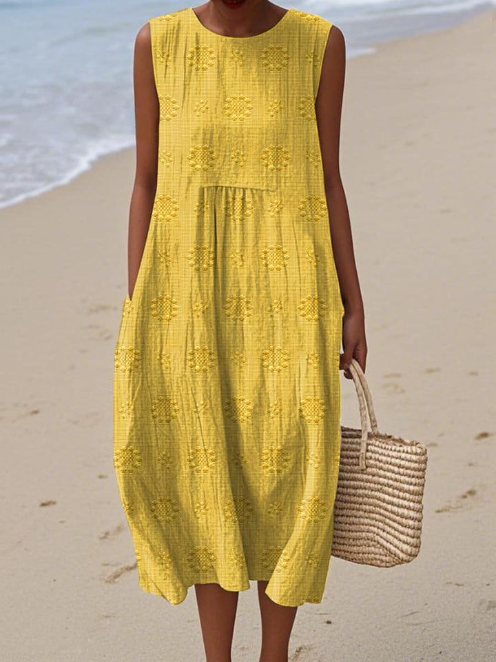 Woman twirling in a comfortable sleeveless flowy midi dress, ideal for summer vacations, beach outings, or casual everyday wear.