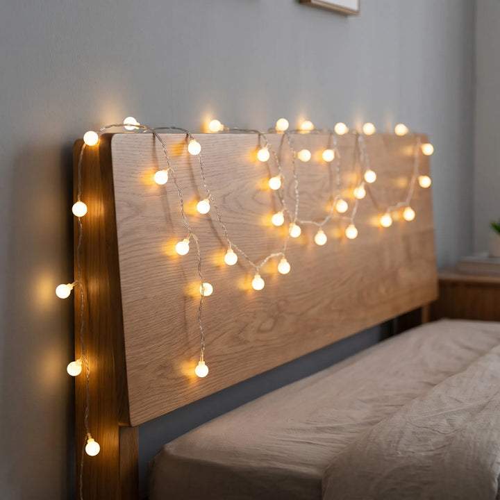 Frosted globe LED string lights, perfect for indoor/outdoor ambient decor, party, or bedroom mood lighting.