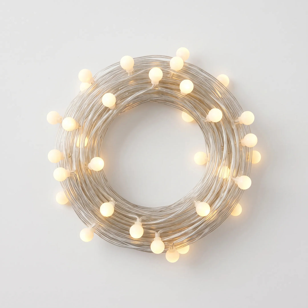 Battery/USB powered frosted globe LED string lights, ideal for decorative indoor & outdoor lighting ambiance.