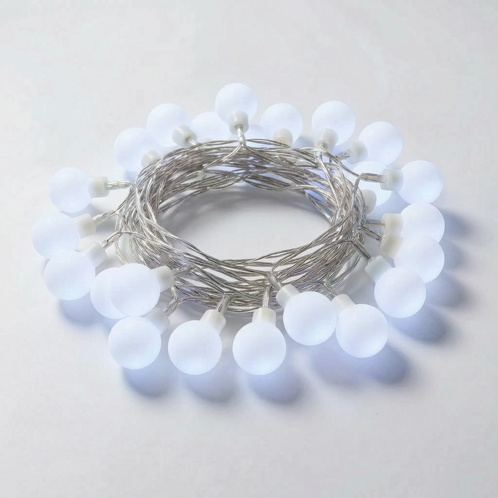 Decorative frosted globe LED string lights for ambient home & garden, patio, or indoor mood lighting.