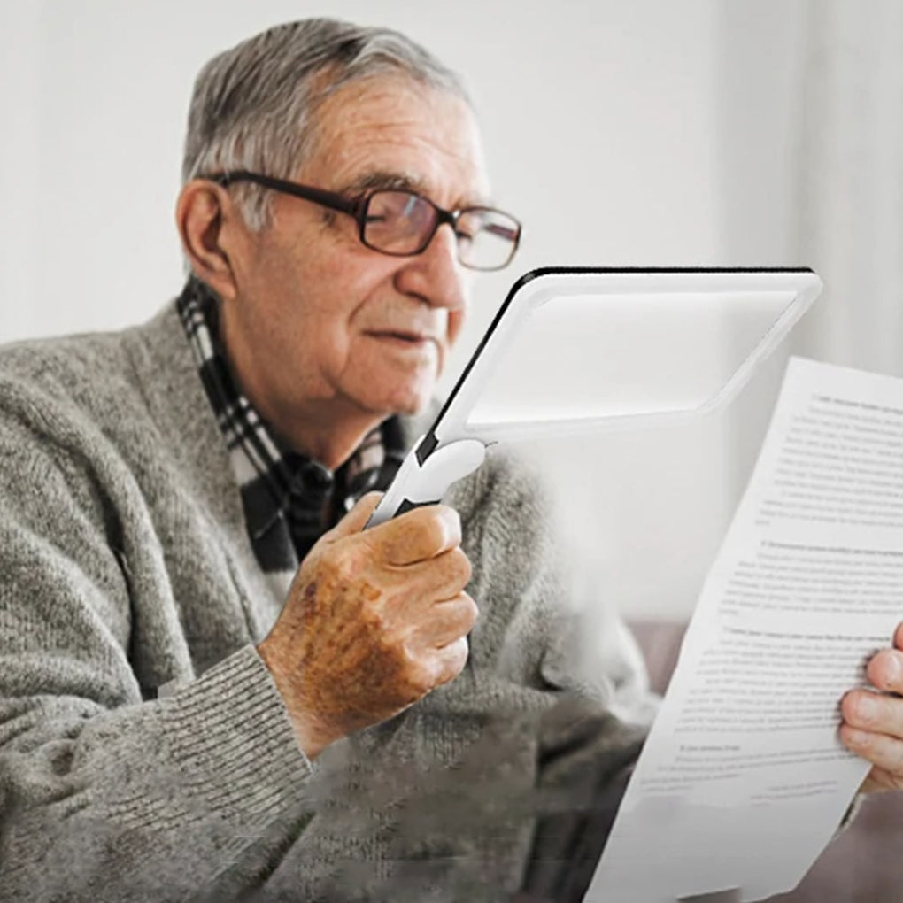 Full page magnifying glass with comfortable handle for clear, hands-on reading and low vision aid.