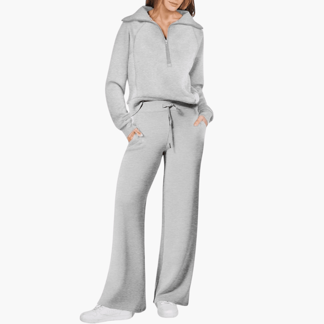 Close-up of a cozy women's zip-up hoodie, part of a comfortable matching lounge set with wide leg pants. Relaxed fit.