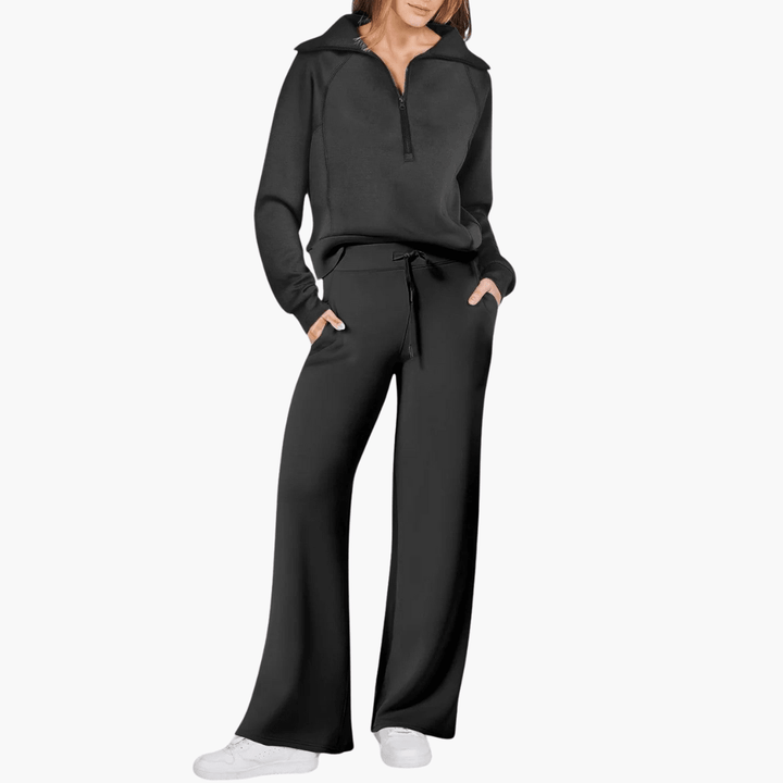 Woman wearing a comfortable women's zip-up hoodie and wide leg pants lounge set, perfect for cozy at-home leisurewear.