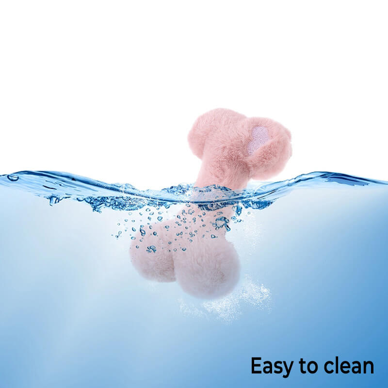 Dog happily playing with Funny Bone squeaky plush chew toy, washable pet enrichment supply