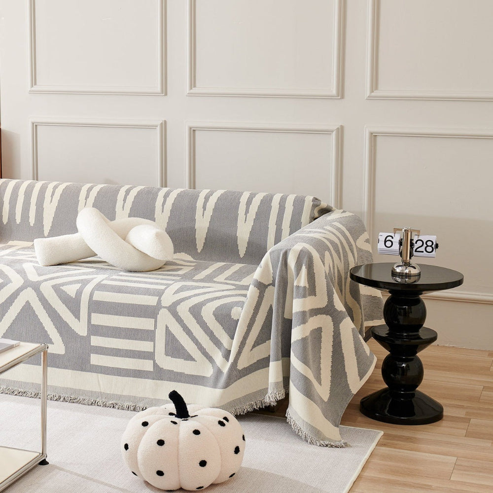 Detailed view of a geometric and boho-inspired couch cover for modern homes
