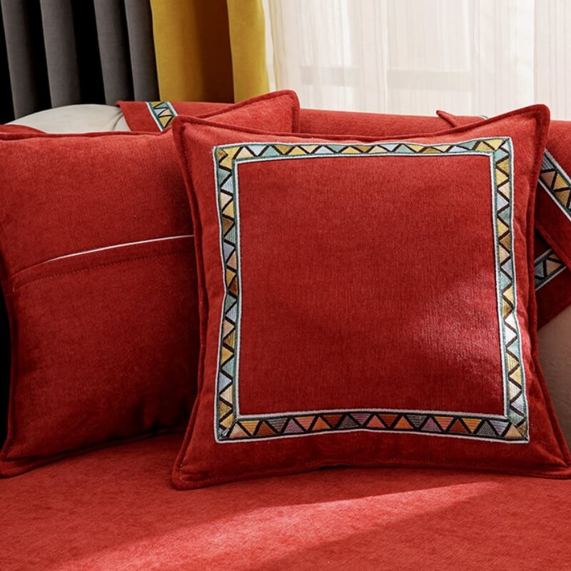 Detail of the thick chenille fabric of a geometric sofa cover, ideal for home decor and pets