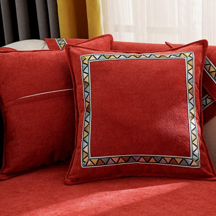 Detail of the thick chenille fabric of a geometric sofa cover, ideal for home decor and pets