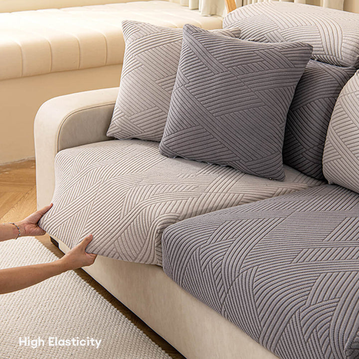 Close-up of geometric jacquard stretch sofa cover texture, ideal for pet protection.