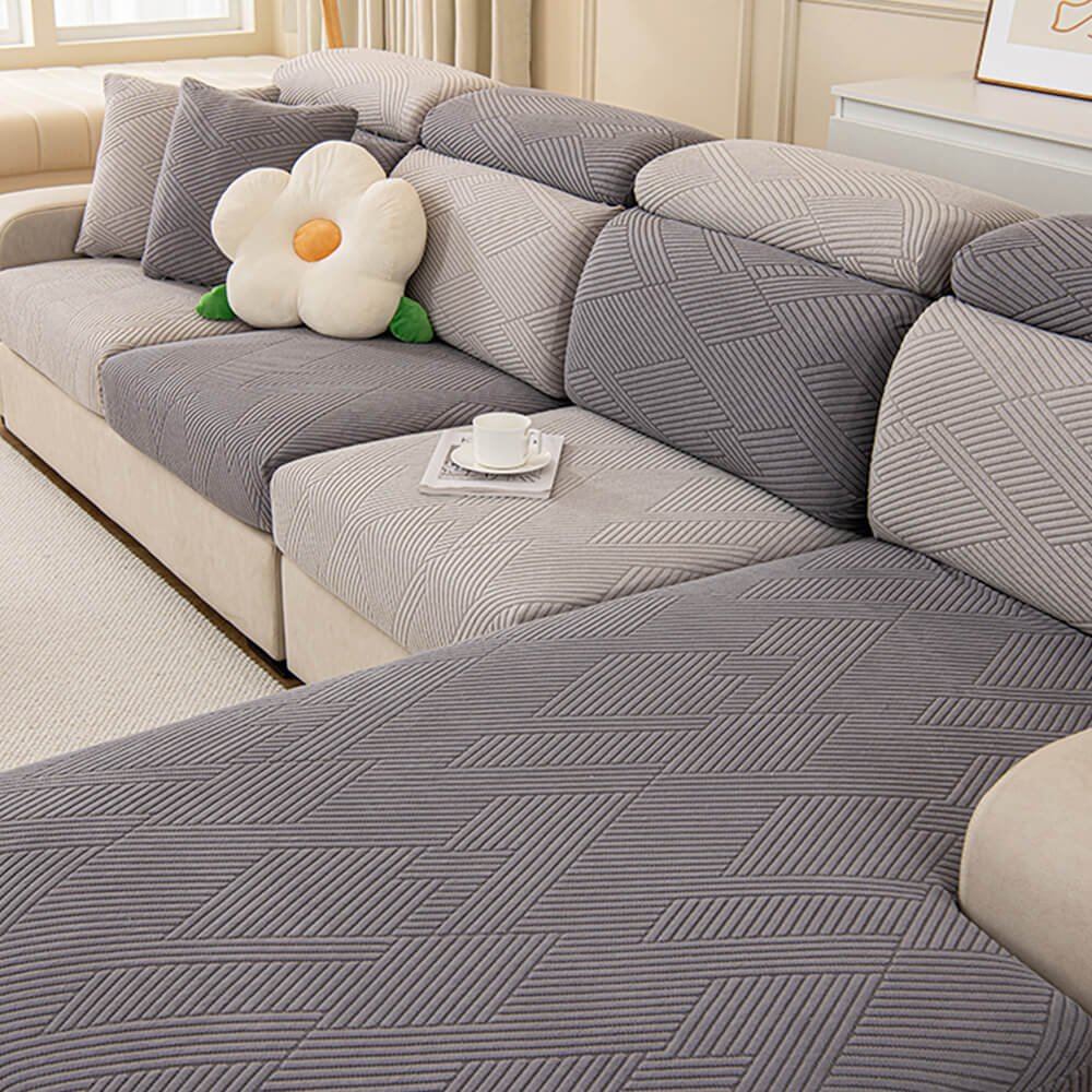 Fully wrapped sofa with a geometric jacquard stretch cover, ultimate pet protection.