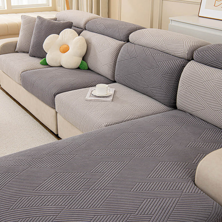 Fully wrapped sofa with a geometric jacquard stretch cover, ultimate pet protection.