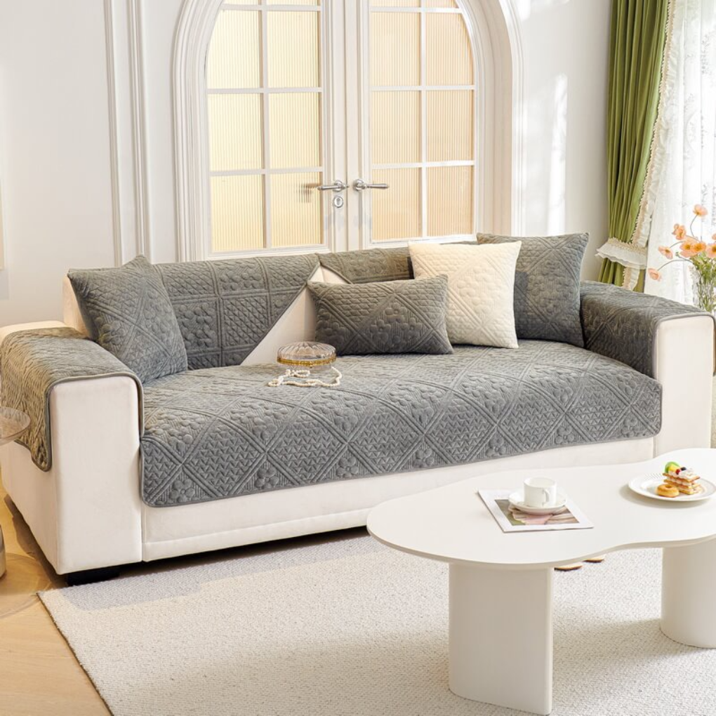 Detailed view of geometric leaves pattern on a non-slip, easy care sectional sofa protector for pets