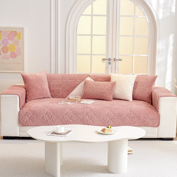 Close-up of the durable fabric and geometric leaves design of the 'New4' non-slip sectional sofa cover