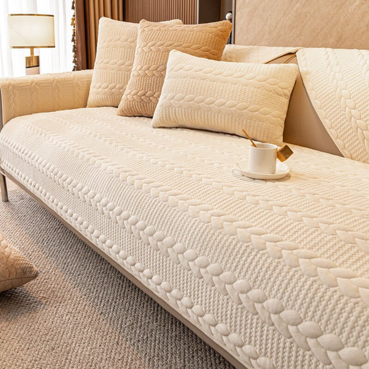 Angled shot of the 'New4' geometric leaves pattern non-slip sectional sofa cover for pet & kid protection