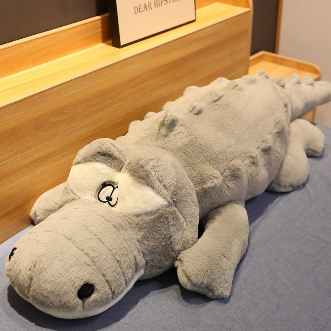 Unisex giant crocodile plush, soft toy & support pillow for comfortable snuggling and imaginative play.