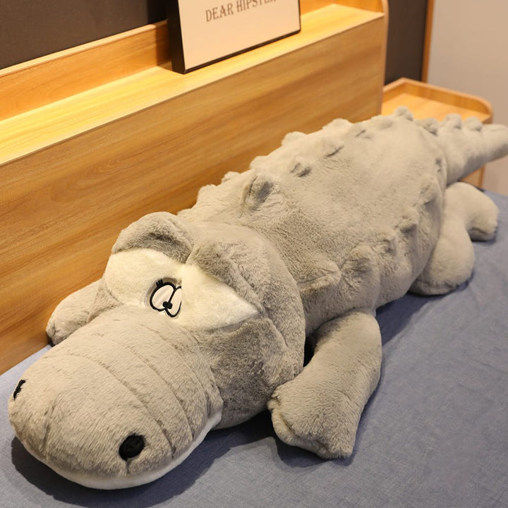 Unisex giant crocodile plush, soft toy & support pillow for comfortable snuggling and imaginative play.
