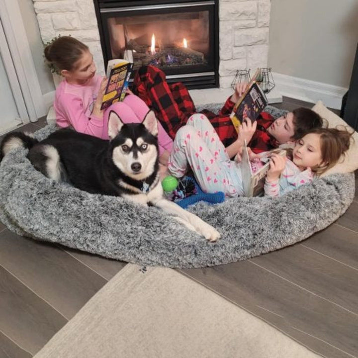 Giant human and pet calming anxiety bed with plush faux fur, designed for ultimate comfort and relaxation