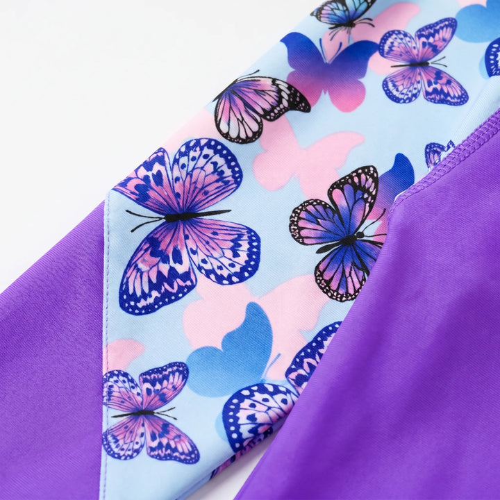 Girls' UV protective long-sleeve rash guard, essential kids swimwear for summer beach days & pool fun.