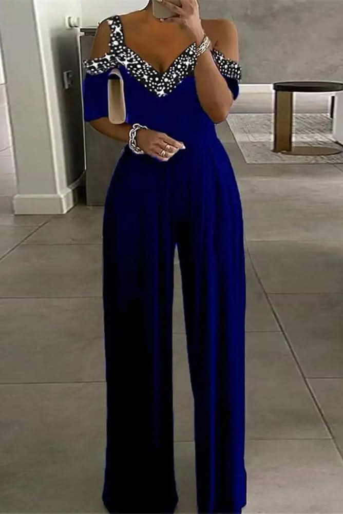 Sparkling women's rhinestone jumpsuit. Elegant one-piece outfit for evening wear, parties, and special occasions. Glamorous.