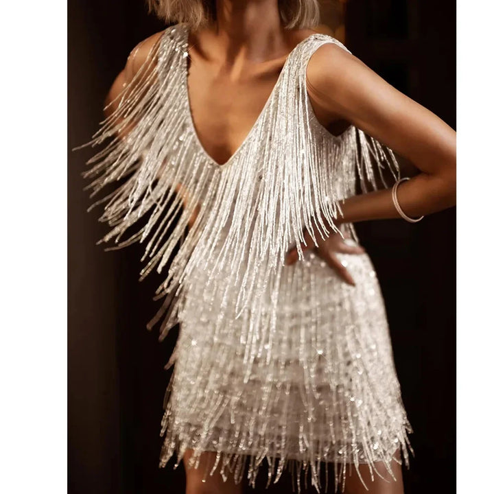 Dynamic women's sequin fringe mini dress, a sleeveless V-neck party outfit for dancing and events.