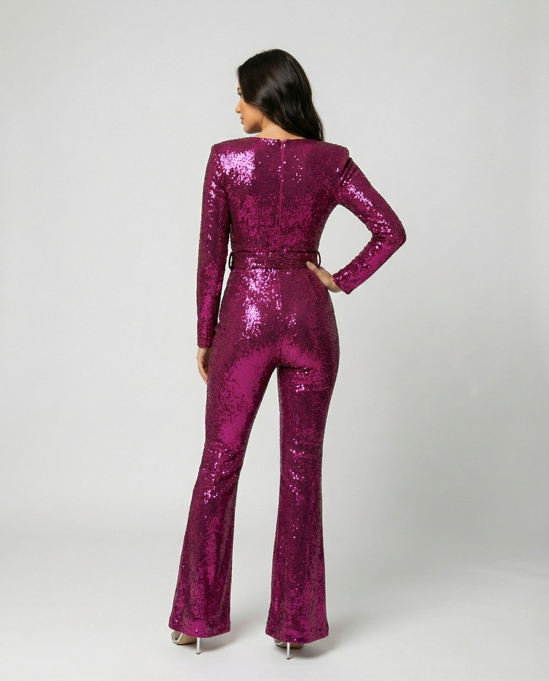 Women's fashion sequin jumpsuit, a glamorous long sleeve party outfit. Sparkle elegantly at your next special occasion.