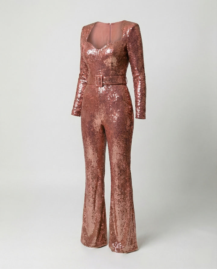 Close-up of a women's glamorous sequin jumpsuit, showcasing sparkle & elegant design. Perfect for evening & special events.