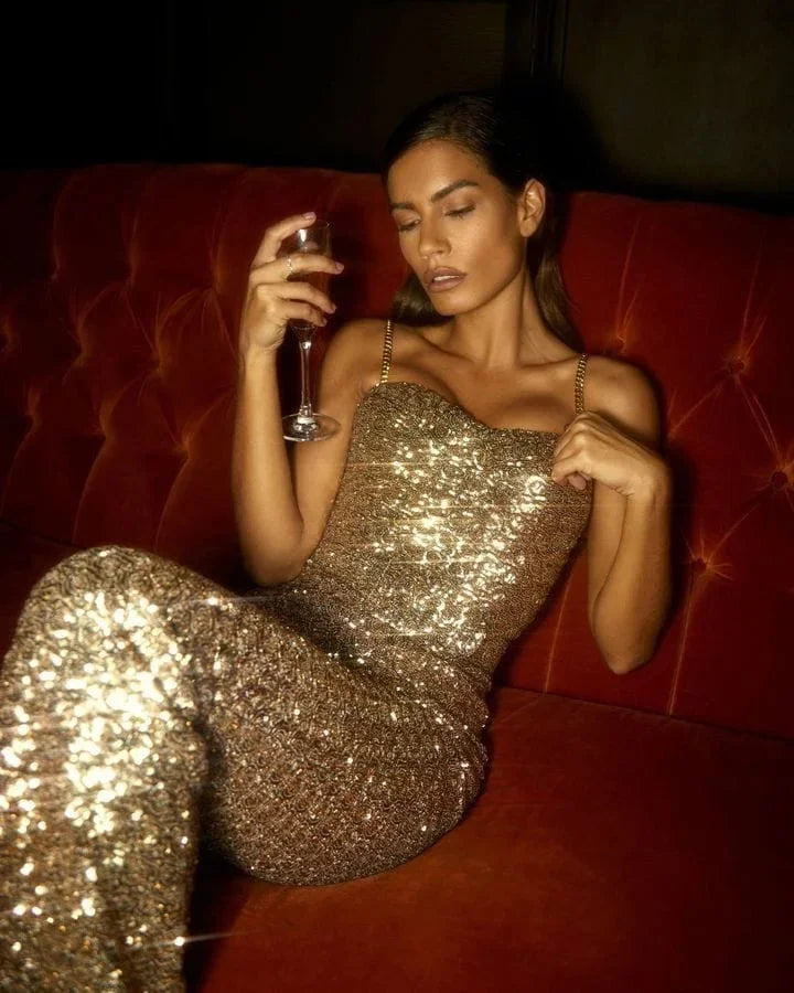 Elegant women's sequin strapless jumpsuit featuring a stylish flared leg, ideal for formal occasions.
