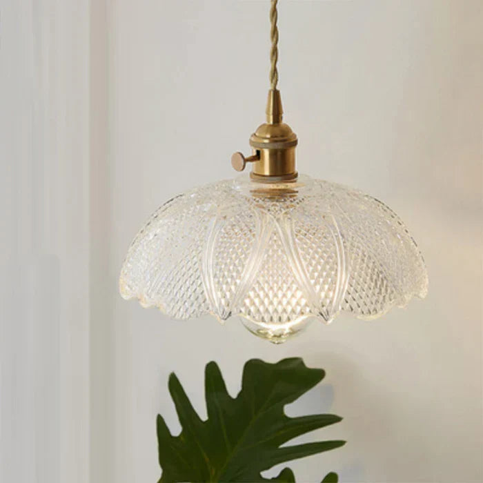 Contemporary glass pendant lamp for dining areas, sleek and modern home decor.