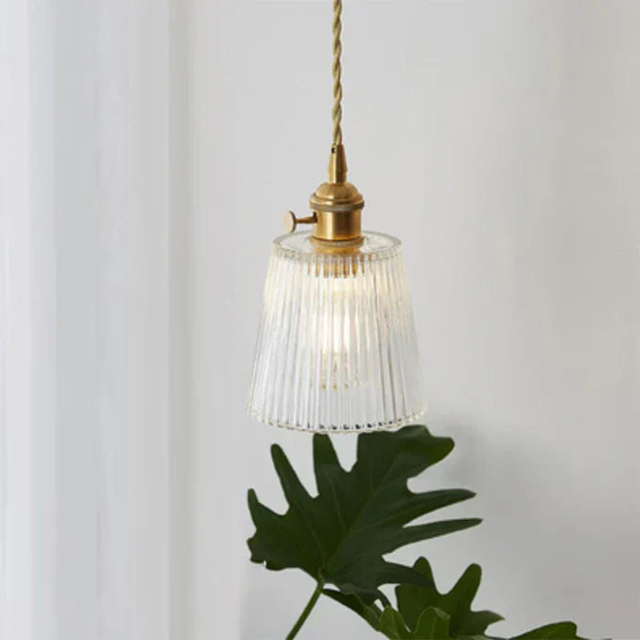 Modern glass pendant lamp for dining room tables. Sleek ceiling light design.