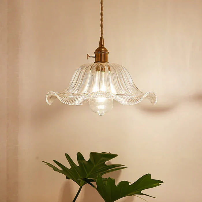 Clear glass hanging lamp, bringing elegance to your dining room decor and lighting.