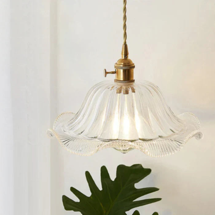 Chic glass hanging lamp, enhancing dining room aesthetics with modern design.