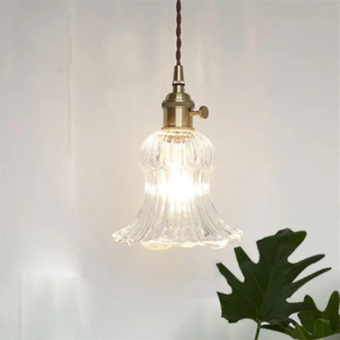 Elegant glass ceiling lamp, perfect for creating a warm dining room atmosphere.