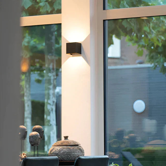Rechargeable white LED motion sensor wall lamp for easy indoor/outdoor mounting, adding modern home lighting.