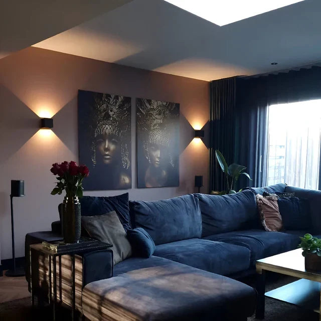 Versatile black/white motion sensor LED wall light, ideal for indoor/outdoor smart home accent lighting.
