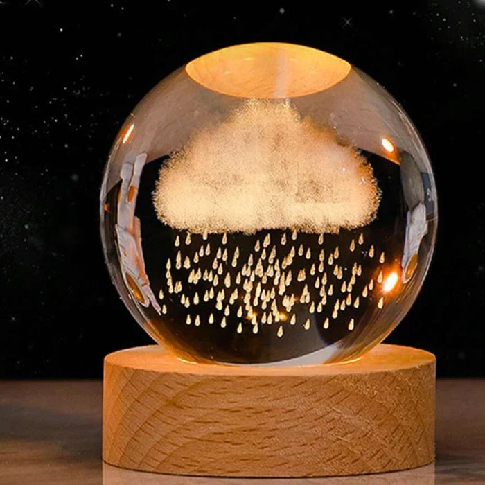 Close-up of 3D engraved galaxy glowing sphere night light, highlighting intricate universe details.