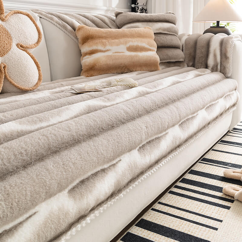 Non-shedding Gradient Stripe Plush Couch Cover draped over a three-seater sofa, modern home decor