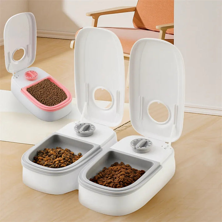 Timed pet feeder for cats and dogs in a sleek gray design, a smart animal care solution.